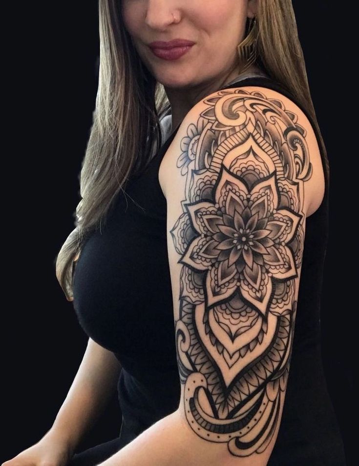 a woman with a tattoo on her arm