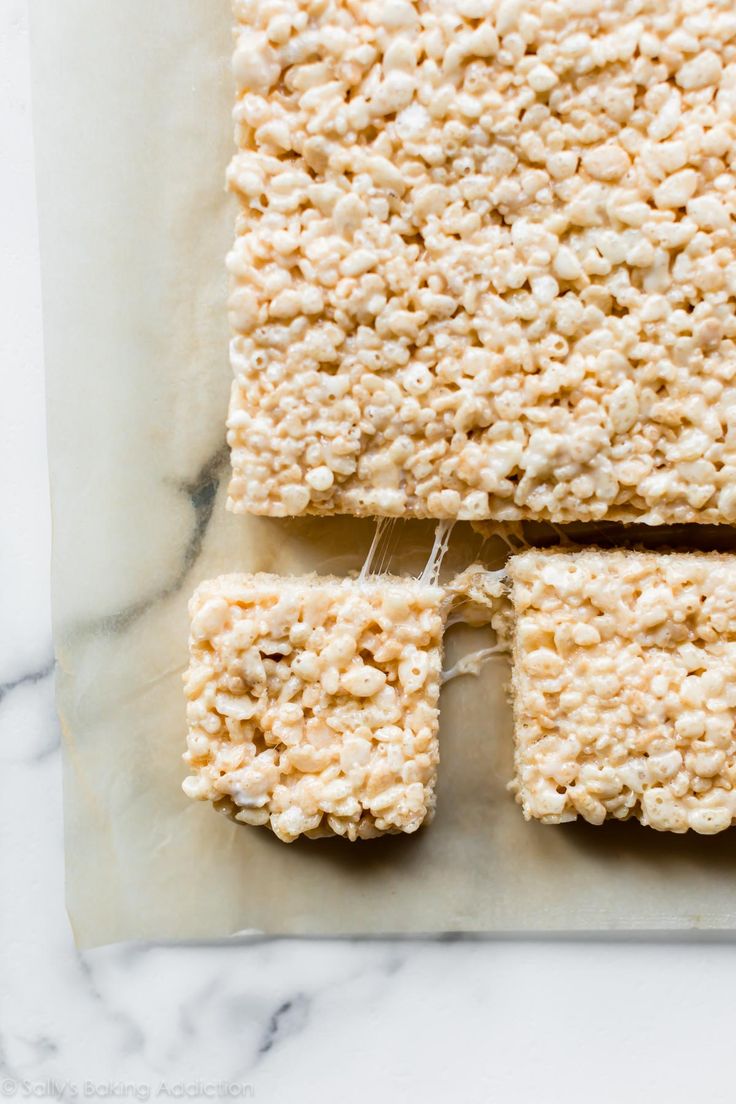 three squares of rice krispy treats sitting on top of each other