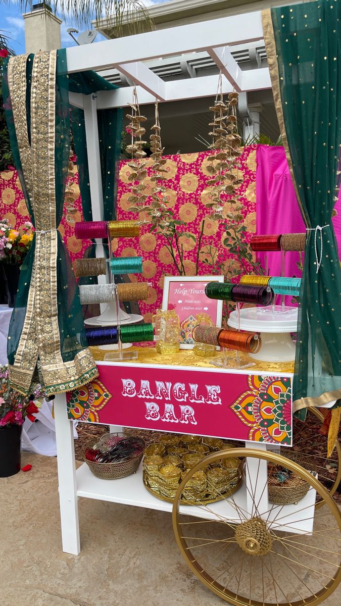 Bangle bar Mendi Party Decorations, Mendhi Taal Ideas, Henna Station At Party, Indoor Mehndi Decor, Mehendi Stall Ideas, Bangle Station Mehendi, Mehendi Set Up, Punjabi Reception Decor, Bangle Bar Indian Wedding