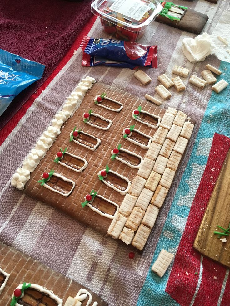 gingerbreads are arranged on a table ready to be cut and decorated for christmas