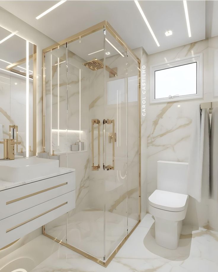 a white bathroom with marble walls and flooring, including a walk in shower stall