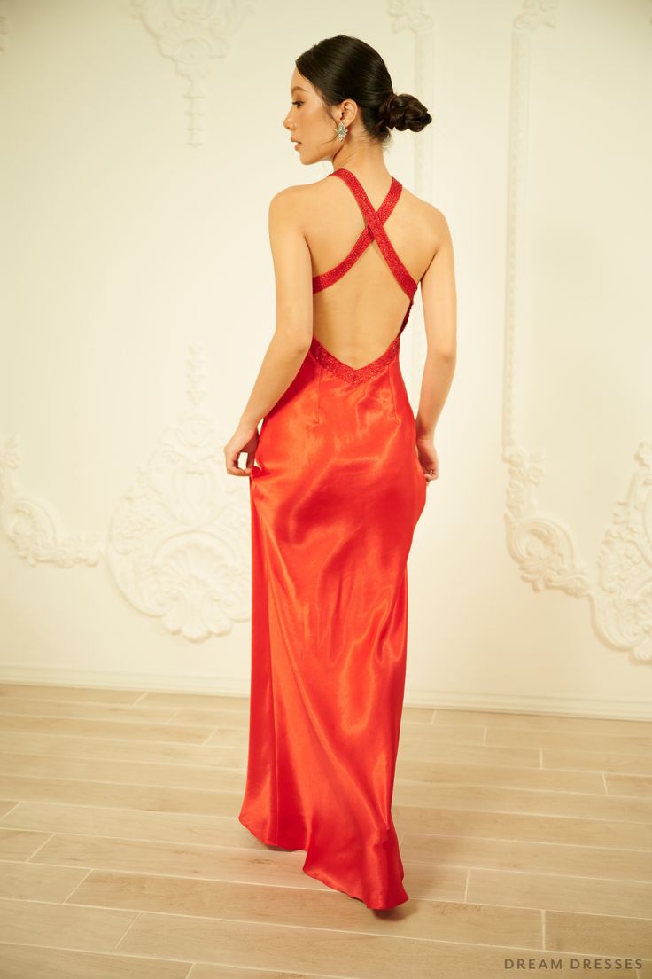 Feel glam and luxurious adorned in our Lucia red silk evening dress with halter neck detailing. Ideal for a rehearsal dinner, make a bold entrance in this stunning gown. Lucia features a cut-out detailing in the front and open back adding a sultry flair while keeping the overall look sophisticated and classy. Beading work along the neckline and waist add a subtle sparkle and shine. The dress: Color: red Neckline: halter neck with cut-out Back: open back with straps Details: beadings on neckline Luxury Halter Neck Evening Dress For Party, Luxury Backless Evening Dress For Gala, Luxury Backless Gown For Evening, Luxury Backless Evening Dress, Silk Halter Neck Evening Dress For Night Out, Halter Neck Evening Dress With Keyhole Back For Gala, Floor-length Evening Dress With Keyhole Back For Prom, Silk Halter Dress With Fitted Bodice For Evening, Luxury Backless Evening Maxi Dress