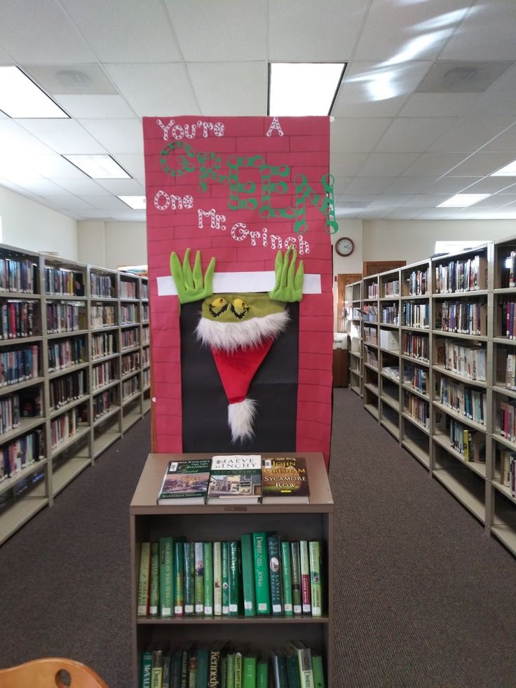 an elf's face is on the back of a book shelf in a library