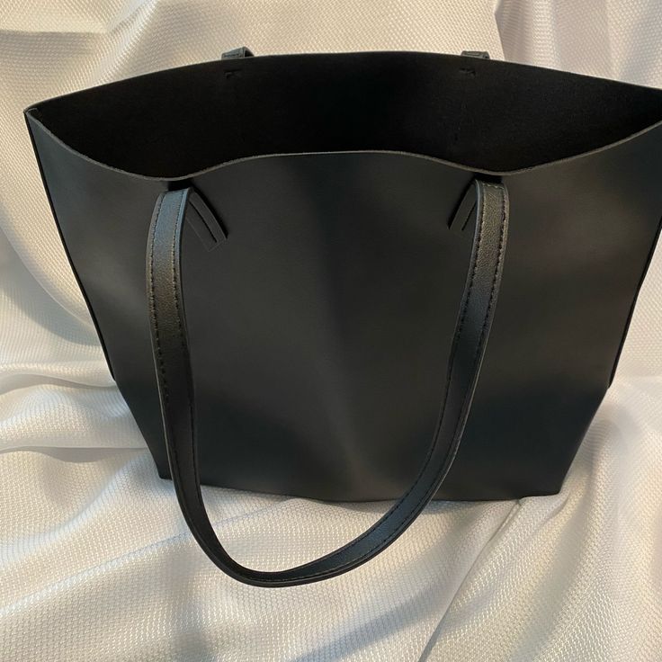 Black Macy’s Tote Bag. Steve Madden Bwilde Flat Tote, Black Large Capacity Bag For Errands, Large Capacity Black Bag For Errands, Black Tote Shopping Bag, Black Tote Bag For Shopping, Black Square Shoulder Bag, Chic Black Square Shoulder Bag, Black Square Bag With Removable Pouch, Black Square Bags With Removable Pouch