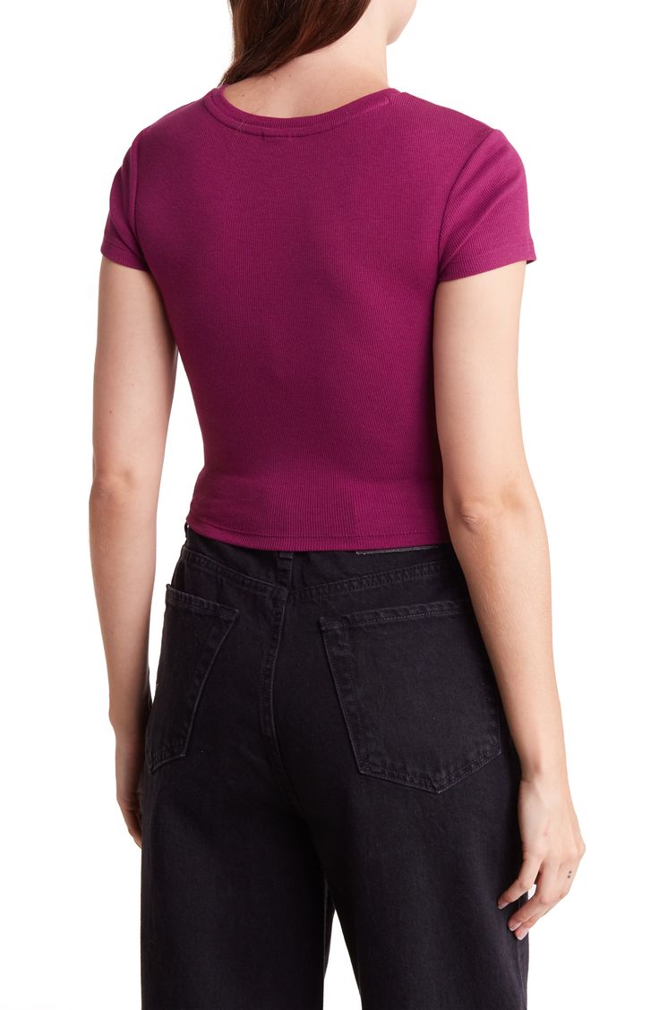 Corset-style seams add structure to a cropped length baby tee that features cap sleeves and rib knit construction. Crewneck Cap sleeves 58% Organic Cotton, 38% Recycled Polyester, 4% Spandex Machine wash, tumble dry Imported Model stats: 5'10" height, 32" bust, 25" waist, 36" hip. Model is wearing size S Fitted Solid Crop Top With Ribbed Neckline, Basic Solid Cropped T-shirt With Ribbed Detail, Fitted Short Sleeve Crop Top With Ribbed Neckline, Fitted Crop Top With Ribbed Neckline And Short Sleeves, Fitted Ribbed Basic Cropped T-shirt, Fitted Cropped Tops With Ribbed Neckline, Fitted Ribbed Cropped T-shirt, Fitted Ribbed Cropped T-shirt Basic Style, Basic Ribbed Cropped T-shirt