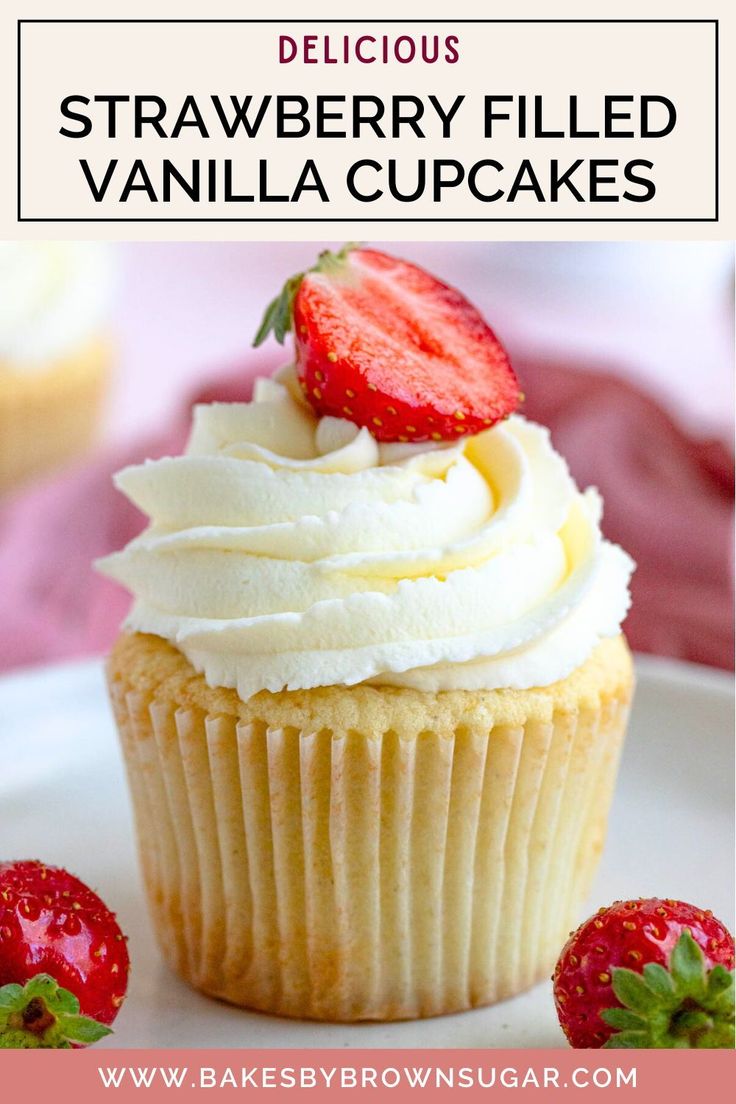 strawberry filled vanilla cupcakes on a plate with strawberries