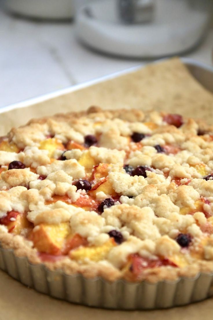 a pie sitting on top of a wooden cutting board