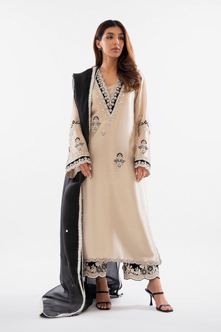 Shyra – Sania Maskatiya International Tissue Pakistani Suits, Pakistani Straight Suits, Pakistani V Neck Designs, V Neck Pakistani Suit, Elegant Gold Long-sleeve Palazzo Set, Elegant Velvet Salwar Kameez For Festive Occasions, Elegant Long Sleeve Velvet Traditional Wear, Elegant Semi-stitched Velvet Salwar Kameez, Elegant Velvet Traditional Wear For Eid