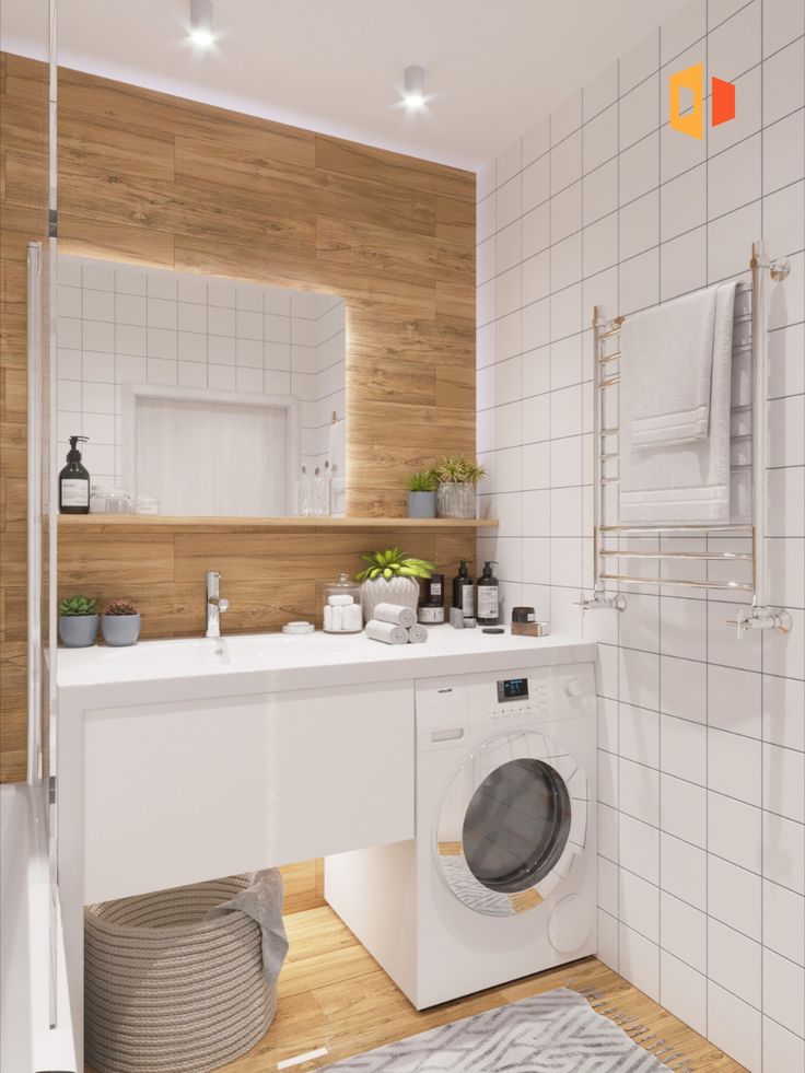 a washer and dryer in a bathroom with wood paneling on the walls