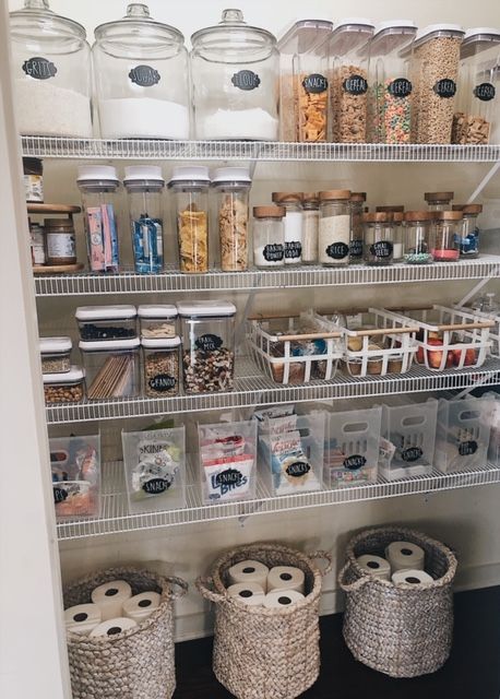 an organized pantry with baskets and containers