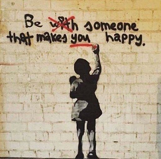 a painting on the side of a building that says be with someone that makes you happy