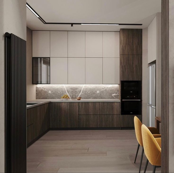 a modern kitchen with wooden cabinets and white counter tops, along with yellow chairs in the foreground