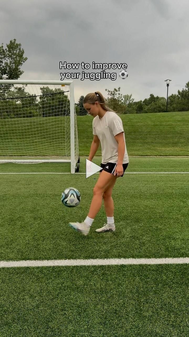 a woman is kicking a soccer ball on the field with an inspirational quote about how to improve your juggling