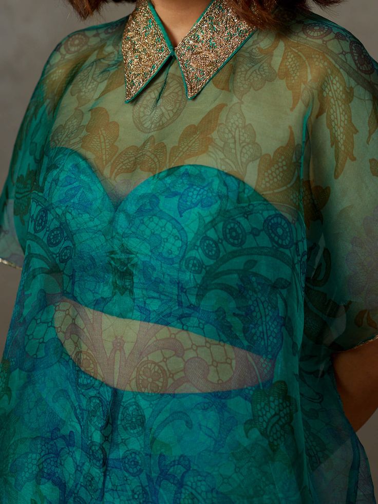 Editor's Note Elevate your style with our emerald zardozi light-hand embroidered primrose kurti, paired with a bustier and pants. This ensemble combines intricate hand embroidery with a contemporary design, making it an excellent choice for special occasions and celebrations, exuding elegance and charm. Color: Emerald Fabric: Silk organza Components: Kurta, bustier and pants Occasion: Festive Note: Product colour may slightly vary due to photographic lighting sources Care: Dry clean only About t Emerald Green Shirt, Emerald Fabric, Organza Kurti, Indo Western Outfits, Printed Embroidery, Fusion Wear, Lehenga Designs Simple, Shirt Pant, Ritu Kumar