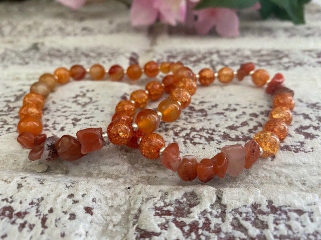 This is a one-of-a kind Orange beaded bracelet. Each bracelet is made unique so you will be the only one with this style bracelet. This beauty features crystal orange colors and orange stones. Orange Spiritual Beaded Bracelets, Adjustable Orange Beaded Spiritual Bracelet, Spiritual Orange Adjustable Beaded Bracelets, Adjustable Orange Spiritual Beaded Bracelet, Handmade Orange Spiritual Bracelets, Handmade Orange Bead Stretch Bracelet, Handmade Orange Stretch Bracelet With Round Beads, Orange Bohemian Beaded Bracelets With Faceted Beads, Orange Beaded Stretch Bracelet With Round Beads