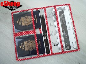 three passport holders sitting next to each other on top of a white table with red polka dots