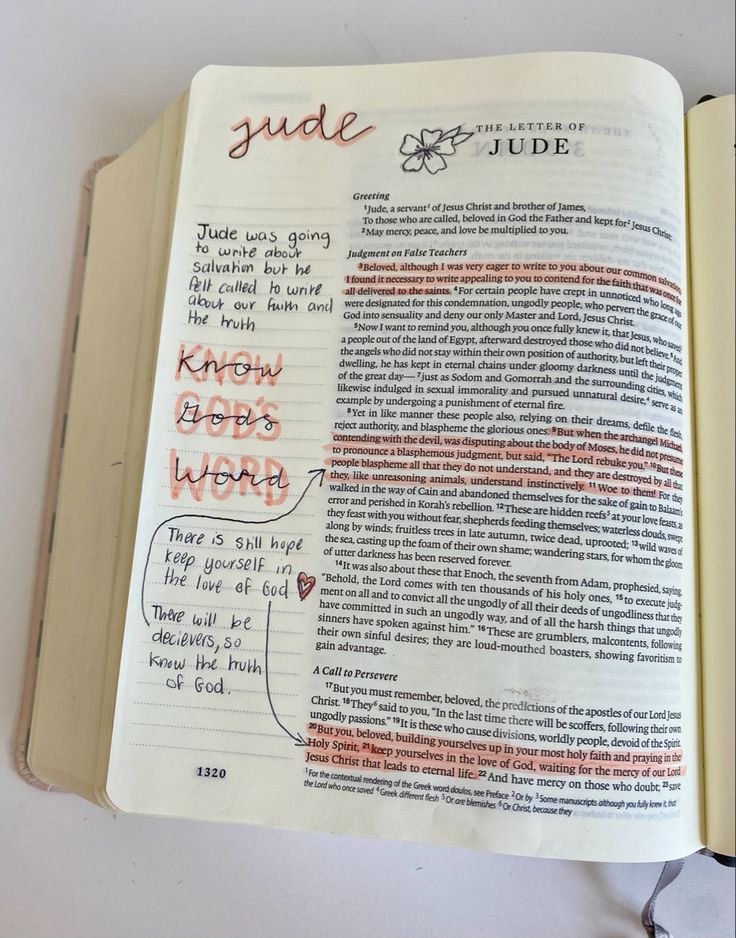 an open bible with writing on it