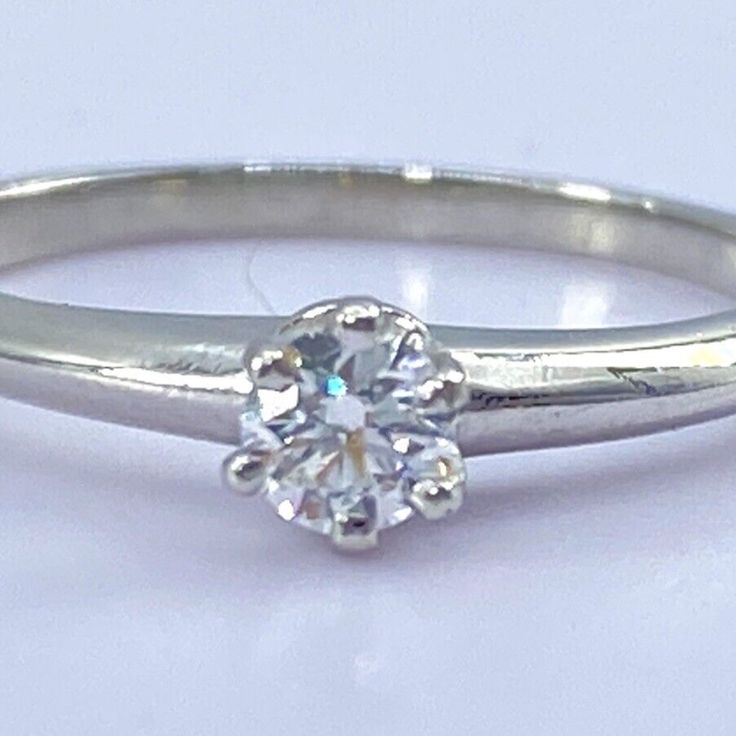 Tiffany & Co Diamond Solitiare Engagement Ring Solid 950 Platinum 1 X Natural Round Diamond Quality: Very Satisfactory (Vs2) Color: E ( Superior White) .18 Ct Measures (Mm) : 4 Size: 6 Weighs (Grams ) : 5.5 Marked : Tiffany & Co Pt 950 21133868 .18 Ct Retail Price $ 1800 Jewelry Tiffany, Solitaire Diamond Engagement Ring, Solitaire Diamond, Tiffany Co Jewelry, Diamond Solitaire Engagement Ring, Diamond Solitaire, Womens Jewelry Rings, Diamond Engagement Ring, Tiffany & Co.