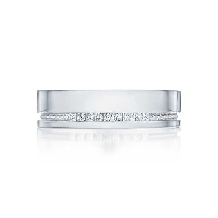 a white gold wedding band with princess cut diamonds on the side and channel set in between