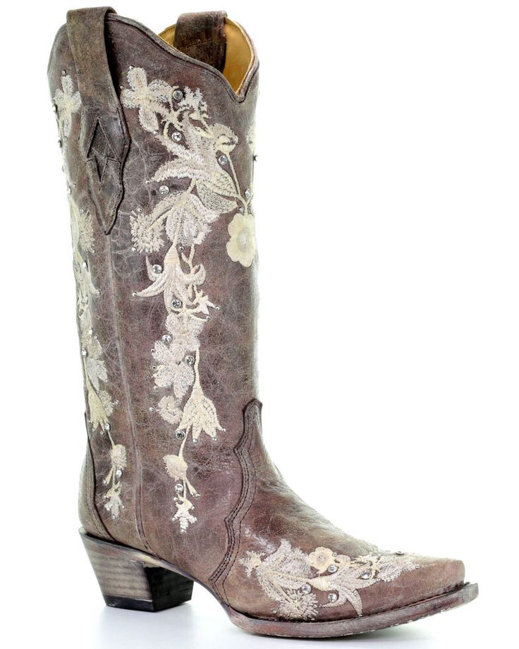 a pair of cowboy boots with embroidered flowers