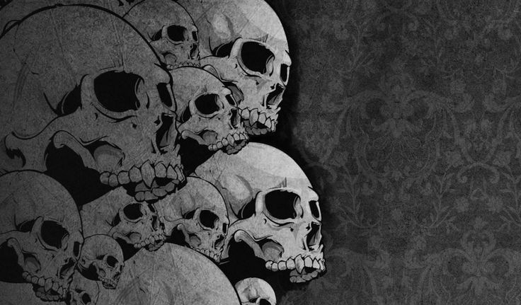 a bunch of skulls sitting next to each other on a black and white wallpaper