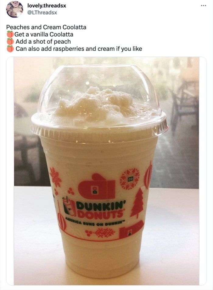 a plastic cup filled with ice cream on top of a table