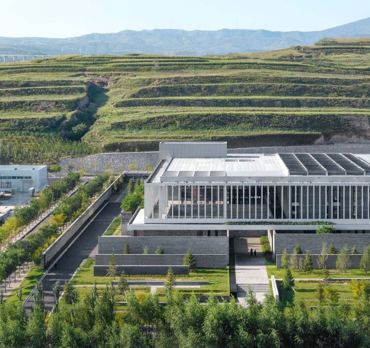 an aerial view of a building in the countryside