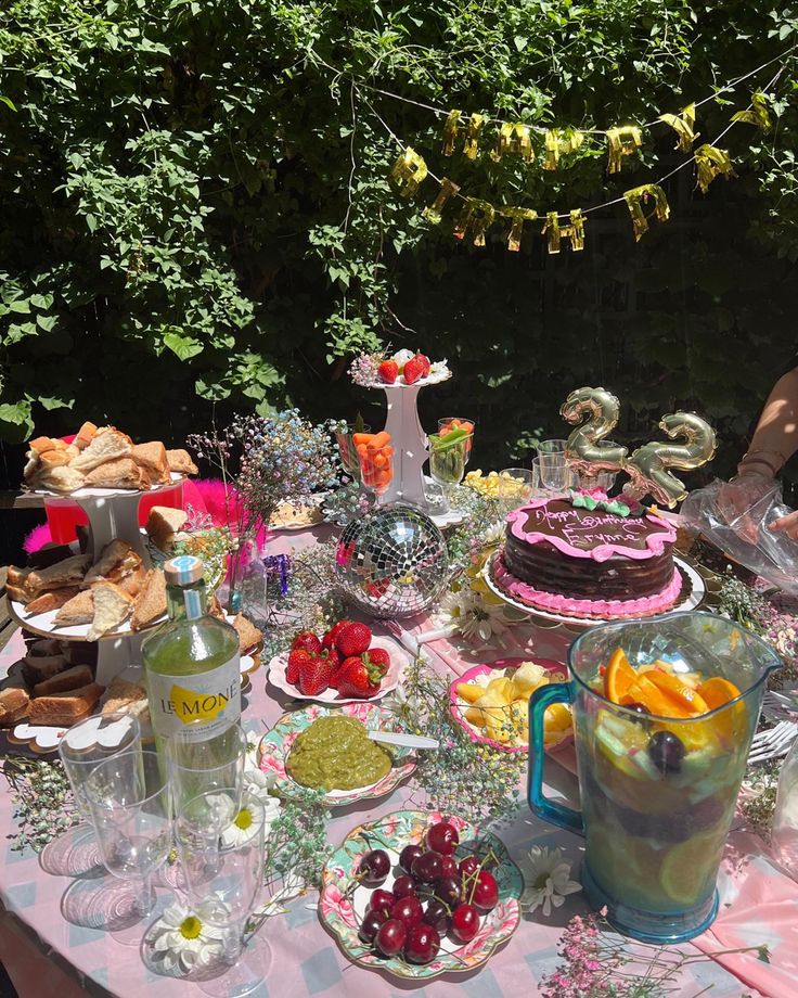 a table topped with lots of food and drinks