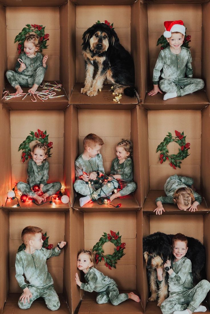 a group of children sitting in boxes with christmas decorations on them and a dog standing next to them