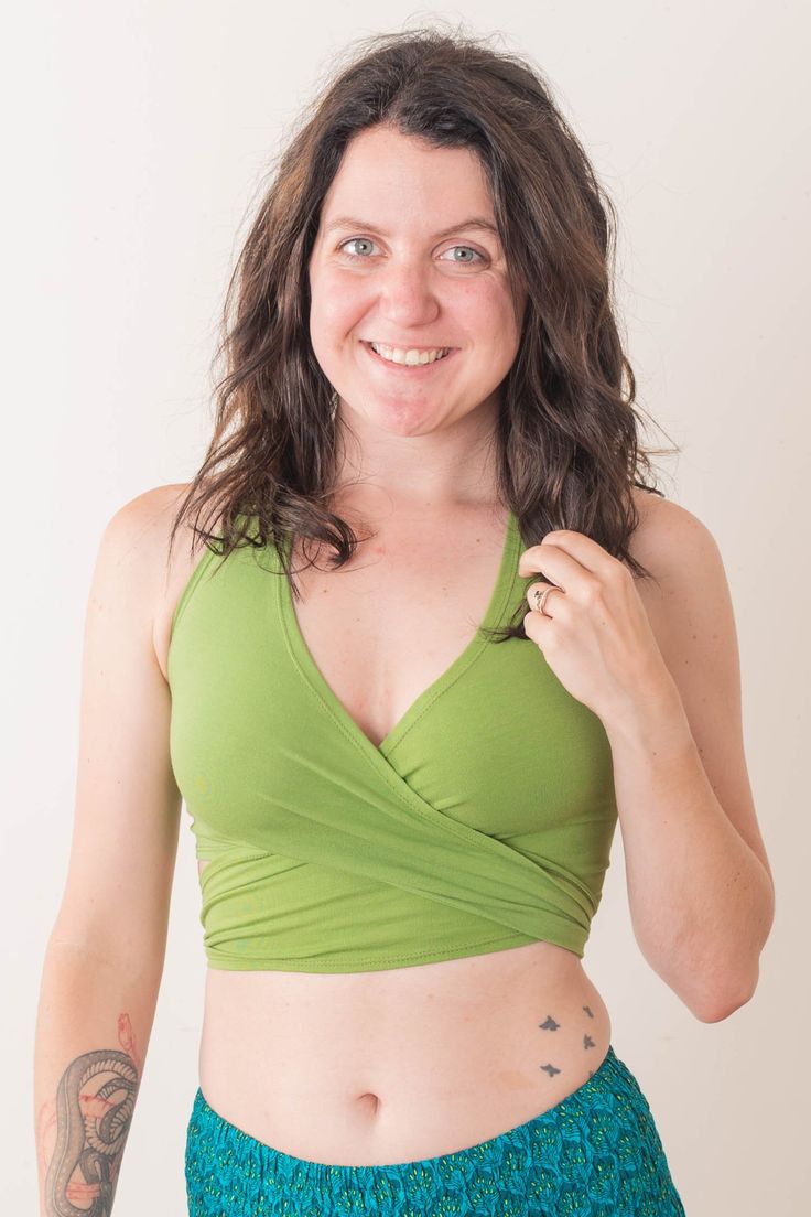 With a sweet wrap style and unique strappy back, this cute crop top is perfect for yoga or summer fun! 90% cotton, 10% lycra Fits Small - Medium sizes (A-C cup) To view our models and their measurements visit ourmodel guide. Carly, Chelsey, Diana, and Chelsea wear SChest: Approximately 30-38", Length of center back: 11.5"*Coral Color Only:Chest: Approximately30-34" Stretch Green Halter Top With Built-in Bra, Spring Yoga Halter Top With Built-in Bra, Stretch Crisscross Halter Top With Built-in Bra, Versatile Stretch Halter Top With Tie Back, Versatile Fitted Wrap Top, Spring Yoga Halter Top, Bra-friendly, Spring Yoga Halter Top, Bra Friendly, Spring Bra Friendly Halter Top For Yoga, Versatile Fitted Halter Top For Yoga