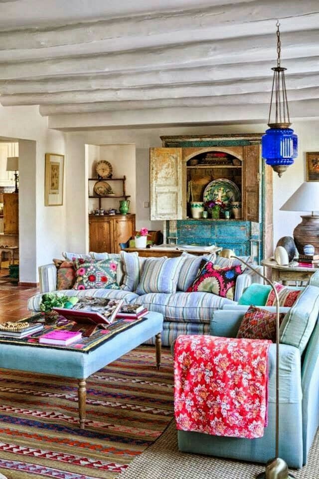 a living room filled with lots of colorful furniture