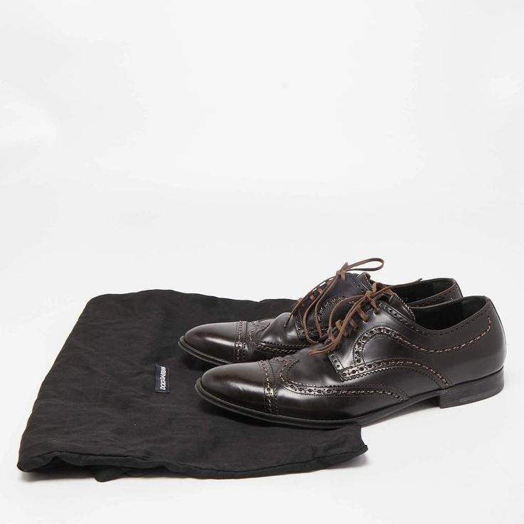 description: Take your shoe game a notch up with these designer derby shoes from Louis Vuitton. The brown leather formal shoes for men are added with lace-up closure and low heels..gender: Men.includes: Original Dustbag.Size: UK 7 (EU 41/US 8).Exterior Material: Leather.Lining Material: Leather.Insole Material: Leather.Sole Material: Rubber.Origin: Italy.Closure Type: Lace Up.Outsole Length: 32 cm.Outsole Width: 10 cm.Condition:.Good.Overall in good condition with minor wrinkles & scuff on exterior, minor wear on sole/insole. Designer Leather Oxfords With Plain Toe, Designer Wingtip Leather Shoes With Rubber Sole, Designer Brown Wingtip Leather Shoes, Designer Calf Leather Lace-up Derby Shoes, Designer Leather Oxfords With Branded Insole, Designer Brown Leather Shoes With Brogue Detailing, Designer Leather Oxfords With Pointed Toe, Brown Brogue Lace-up Shoes In Calf Leather, Brogue Lace-up Shoes In Calf Leather For Business