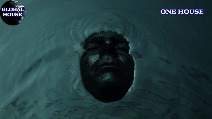 a man is floating in the water with his head above the water's surface