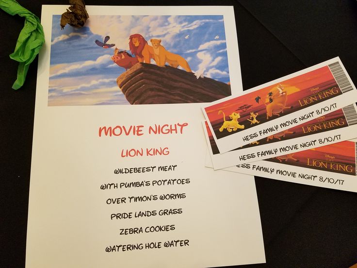 the lion king movie night is on display with tickets and envelopes for guests to use