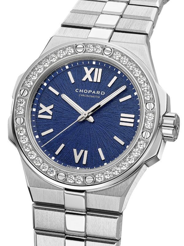 Alpine Eagle 33mm from Chopard featuring indigo blue, round face, Roman numeral dial, baton hands, diamond-encrusted bezel, screw-down crown, adjustable link bracelet, folding clasp, automatic movement, water resistance up to 100m/10 ATM, 33mm and Lucent steel. This item comes with a standard two-year warranty from the brand.. This item is crafted using Fairmined certified gold, ensuring that artisanal and small scale mining organisations meet high standards for social development and environmen Chopard Watch, Bezel Jewelry, Social Development, Roman Numeral, Fine Watches, Mechanical Movement, High Standards, Diamond Watch, 100m