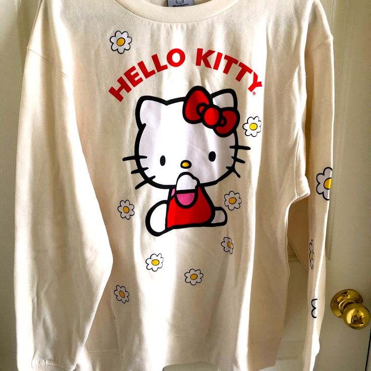 Hello Kitty Sweatshirt Size: M Color: Off White Brand New Without Tag White Kawaii Sweatshirt With Graphic Print, White Long Sleeve Sweatshirt With Cat Print, Hello Kitty Cotton Sweatshirt In Kawaii Style, Cute Cotton Sweatshirt With Hello Kitty Print, Hello Kitty Long Sleeve Cotton Top, Kawaii Long Sleeve Top With Hello Kitty Print, White T-shirt With Cat Print For Fall, Long Sleeve Cotton Hello Kitty Top, Trendy Hello Kitty Cotton Sweatshirt