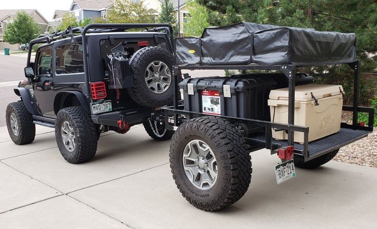 a jeep with a trailer attached to it