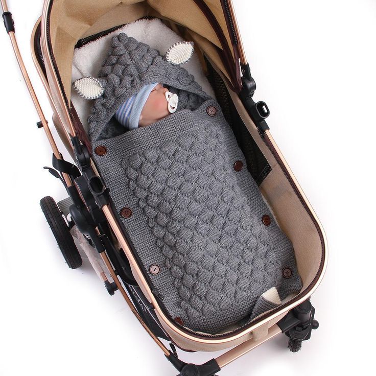 a baby in a stroller is laying down