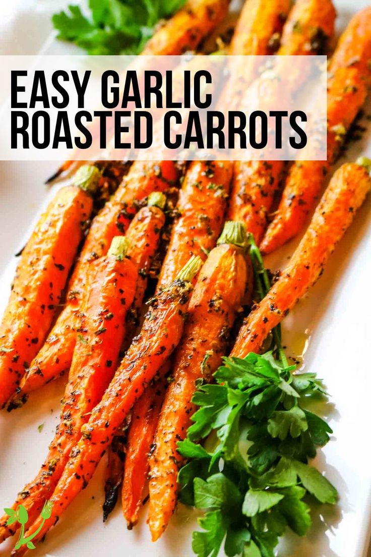 grilled carrots on a white plate with parsley garnish and text overlay that reads easy garlic roasted carrots