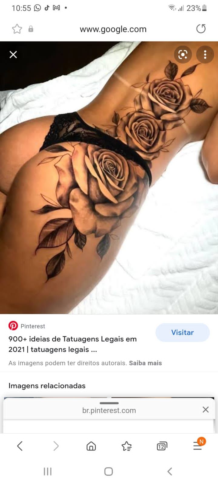 an image of a woman's stomach with roses tattooed on the bottom and side