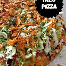 there is a taco pizza with toppings on it