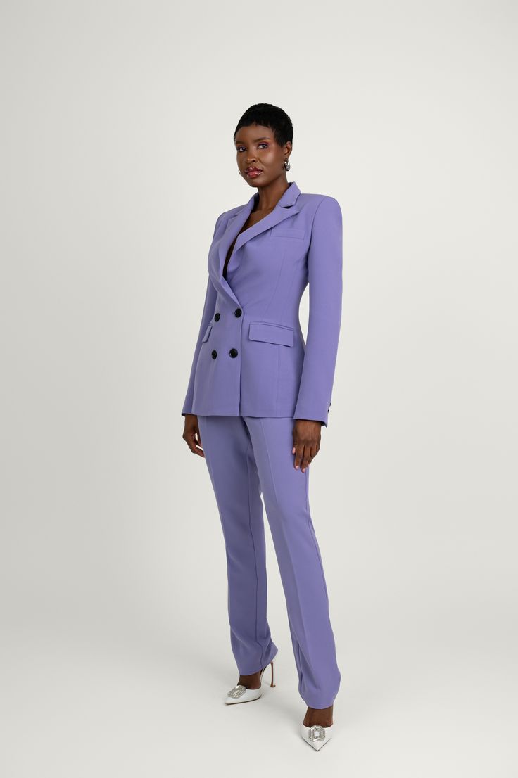 Following our core concept of women's empowerment, we aimed to incorporate the ultimate feminine power suit. Our Kris ensemble consists of a tailored double-breasted blazer with a slim fit and a nipped-in waist, coordinated with straight-leg tailored trousers featuring pressed pleats for a streamlined look. The power factor lies in the sharp shoulders with peaked lapels of the blazer. It also includes pockets on each side and on the wearer's left chest at the front, along with buttoned cuffs at Tailored Structured Pantsuit With Pressed Crease, Tailored Blazer Dress With Structured Boning For Work, Chic Notch Lapel Pantsuit With Double Button, Structured Boning Blazer Dress For Office, Workwear Blazer Dress With Structured Boning And Suit Collar, Tailored Structured Suits For Work, Office Pantsuit With Lapel Collar And Double Button, Elegant Notch Lapel Double-breasted Pantsuit, Chic Career Pantsuit With Lapel Collar