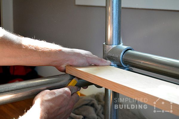 a man is working on a window frame