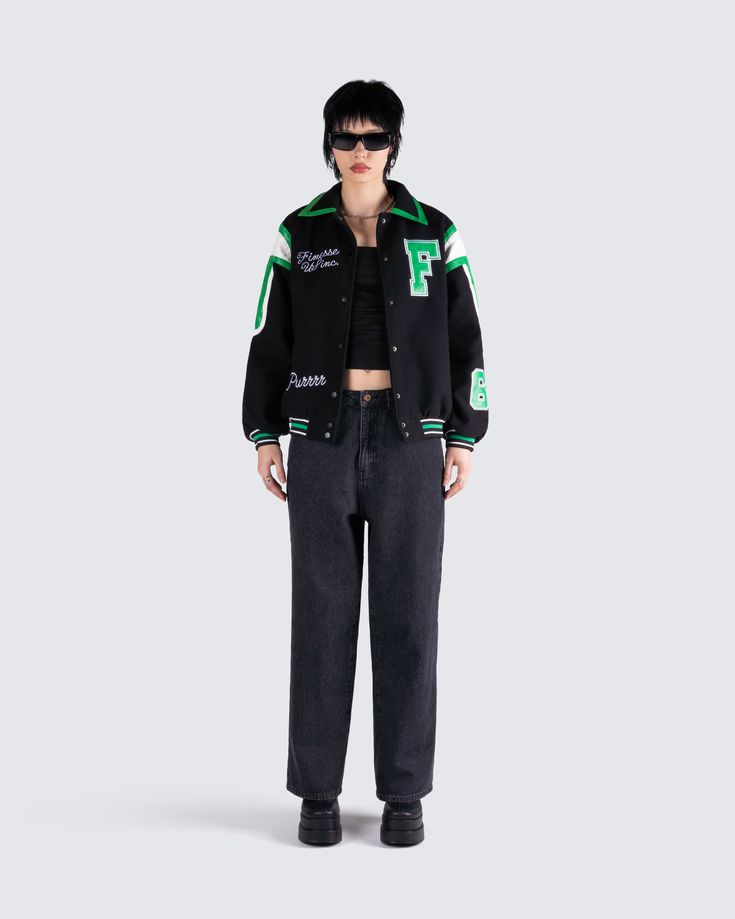 The vibes are... stylish, and bada*s 🙌 This two-piece set featuring a black jersey tube top, a black varsity jacket, and black-washed balloon pants will have everyone trying to get on your level 🖤 Trendy Black Outerwear With Baseball Collar, Black Hip Hop Varsity Jacket For Winter, Black Hip Hop Varsity Jacket For Fall, Trendy Black Sports Outerwear, Black Winter Varsity Jacket For Campus, Black Varsity Jacket With Baseball Collar For Streetwear, Black Sporty Outerwear For Campus, Trendy Black Varsity Jacket For Fall, Black Long Sleeve Varsity Jacket For Campus