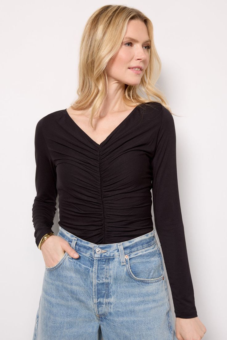 Perfect for a chic night-out look, this long sleeve top by LNA is crafted in rayon-blend fabric and features a fitted silhouette with a flattering ruched front design. Pair with vegan leather, or add wide leg jeans and pumps. | LNA Women's Simone Top, Size XS, Black Ruched Long Sleeve Top For Night Out, Chic Ruched Long Sleeve Fitted Top, Chic Fitted Long Sleeve Top With Ruched Details, Long Sleeve Ruched Top For Night Out, Chic Fitted Ruched Long Sleeve Top, Stretch Ruched Long Sleeve Blouse, Fitted Ruched Long Sleeve Casual Top, Casual Fitted Ruched Long Sleeve Top, Fitted Long Sleeve Ruched Blouse