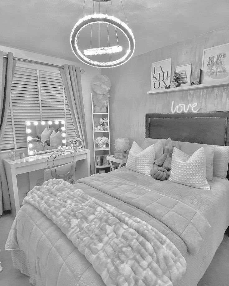 black and white photograph of a bedroom with a large bed