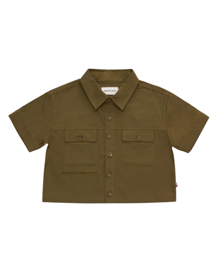 Olive Twill Short Sleeve Button Up, designed to perfectly complement the look of our uniform shorts and pants for boys. Embrace effortless style and functionality with this versatile piece. Short Sleeve Khaki Shirt For Work, Khaki Collared Short Sleeve Shirt With Pockets, Khaki Short Sleeve Utility Top, Khaki Short Sleeve Top With Pockets, Khaki Short Sleeve Shirt With Button Closure, Short Sleeve Button-up Shirt With Rolled Sleeves For Work, Spring Camp Shirt With Short Sleeves And Buttons, Utility Style Short Sleeve Relaxed Fit Shirt, Short Sleeve Utility Tops With Pockets