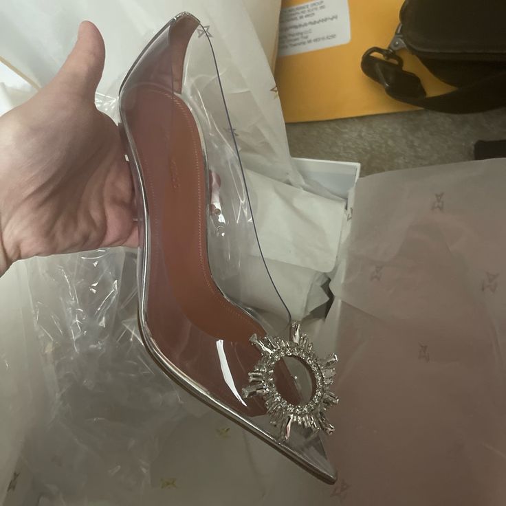 Clear Never Used Brand New Size 9 Amina Muaddi Heels Soles Are Clean Never Used Designer Clear Heels For Formal Occasions, Designer Clear Heels For Evening, Clear High Heels For Formal Occasions, Clear Pointed Toe Heels For Formal Occasions, Luxury Clear Heels For Evening, Formal Clear Heels With Branded Heel Counter, Elegant Clear Heels With Round Toe, Elegant Clear Heels With Heel Strap, Elegant Clear Heels With Sculpted Heel