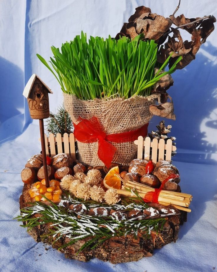 a potted plant sitting on top of a pile of wood next to other items