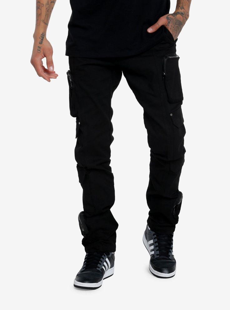 Add more black to your wardrobe with these fitted pants! Featuring cargo and zipper cargo pockets down the legs  plus a skull charm.97% cotton; 3% spandexWash cold; dry lowRise: 11''Inseam: 33 12''Leg: 6 12''ImportedListed in men'sunisex sizesModel is 6'1''Model wears size Medium Techwear Cargo Pants With Zipper For Streetwear, Urban Black Cargo Pants With Zipper Closure, Black Urban Cargo Pants With Zipper Closure, Edgy Cotton Cargo Pants With Side Pockets, Alternative Style Black Pants With Zip Fly, Edgy Cotton Pants With Multiple Pockets, Black Cargo Pants With Zipper For Streetwear, Black Cargo Pants With Zipper Closure For Streetwear, Edgy Cotton Pants With Side Pockets